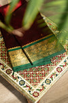 The Royal Garnet: Maroon Silk Saree with Emerald Green Korvai Border