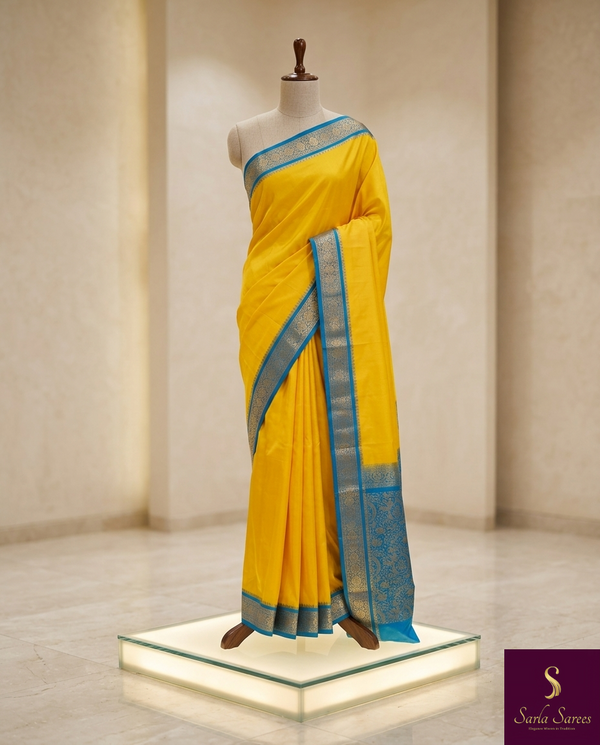 The Summer Sun: Lemon Yellow Silk Saree with Cerulean Blue Border