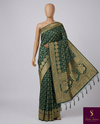 The Royal Mayura: Deep Forest Green Banarasi Silk Saree with Ornate Peacock Brocade