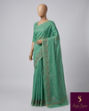 The Nilambari Riva: Mint Green Embroidered Handloom Cotton Saree