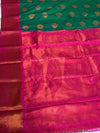 The Sovereign Emerald: Deep Green Kanchipuram Silk Saree with Fuchsia Pink & Gold Zari Border