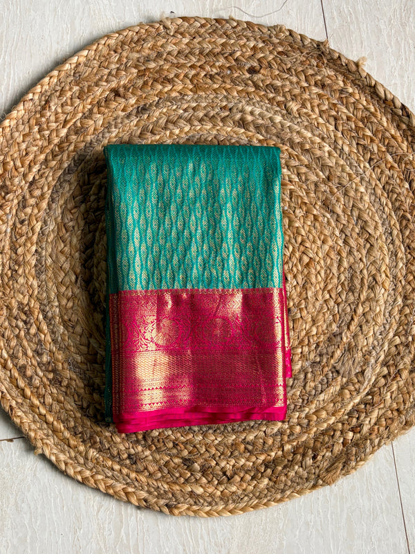 The Emerald Ira: Sea Green & Rani Pink Kanchipuram Silk Saree