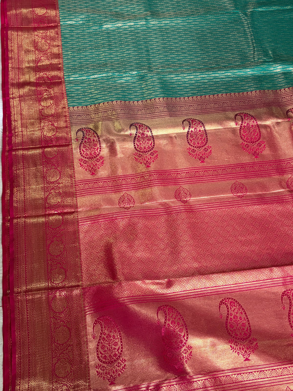 The Emerald Ira: Sea Green & Rani Pink Kanchipuram Silk Saree
