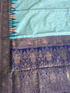The Cerulean Citadel: Powder Blue Pure Linen Saree with Royal Indigo & Temple Border