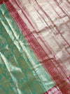 The Vasundhara Vilasa: Sage Green & Coral Red Kanchipuram Tissue Silk Saree