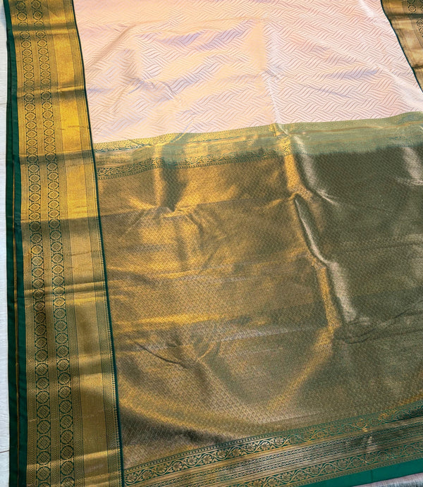 The Blush Orchard: Pastel Peach Silk Saree with Forest Green & Gold Border