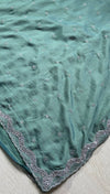 The Sage Horizon: Sea Green Textured Georgette Saree with Scalloped Moti & Cutdana Work Border