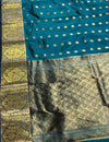 The Teal Treasure: Deep Peacock Silk Saree with Gold Zari Buttas