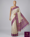 Elegant cream raw silk saree with a rich purple border for a regal touch. π€πβ¨