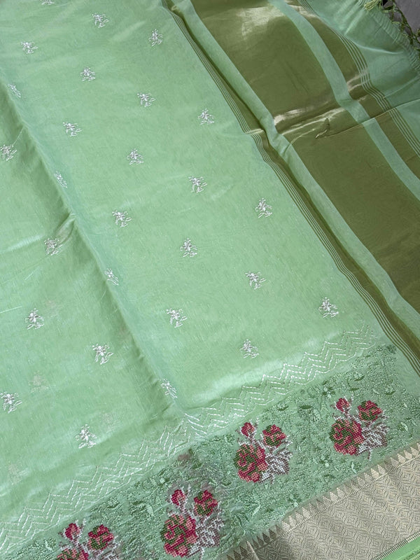 Fresh pista cotton saree with delicate cross-stitch embroidery for a subtle elegant touch. πβ¨