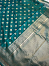 Stunning peacock blue saree with a rich gold border — bold, elegant, and timeless