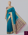 The Sapphire Serenity: Teal Blue Silk Saree with Floral Meenakari Pallu