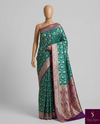The Royal Medallion: Sea Green Silk Saree with Purple Borders