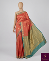 The Coral Mayil: Peach-Salmon Kanchipuram Silk Saree with Teal & Gold Zari Border