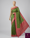The Meadow Garland: Leaf Green Silk Saree with Ornate Pink Floral Brocade