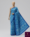The Aegean Arbour: Cerulean Blue Floral Kalamkari-Print Saree with Royal Blue Lace Border