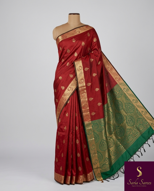 The Crimson Vasundhara: Deep Maroon & Emerald Green Heritage Woven Saree