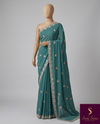 The Tanvi Riva: Peacock Teal Floral Embroidered Georgette Saree