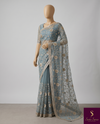 The Meher Riva: Dusty Slate Blue Embroidered Net Saree with Scalloped Border