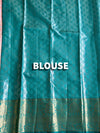 The Revati Vilasa: Coral Peach & Peacock Teal Kanchipuram Tissue Silk Saree