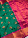 The Sovereign Emerald: Deep Green Kanchipuram Silk Saree with Fuchsia Pink & Gold Zari Border