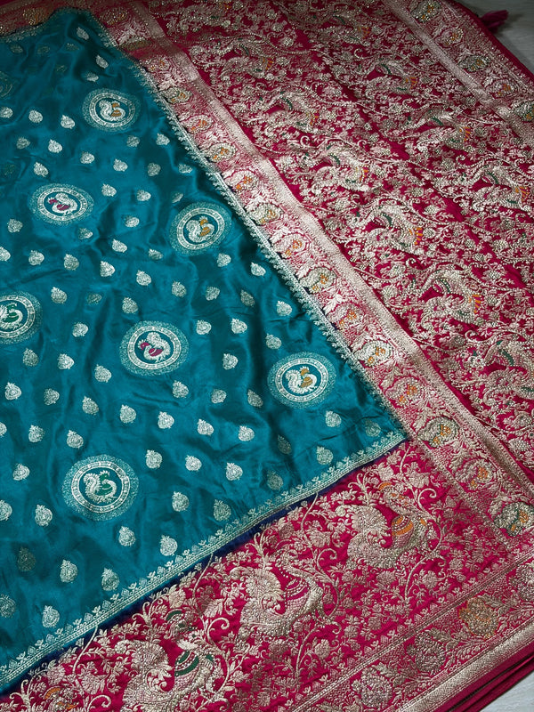 The Empress Teal: Teal Blue Banarasi Katan Silk Saree with Crimson Shikargah Border & Swarovski Crystals