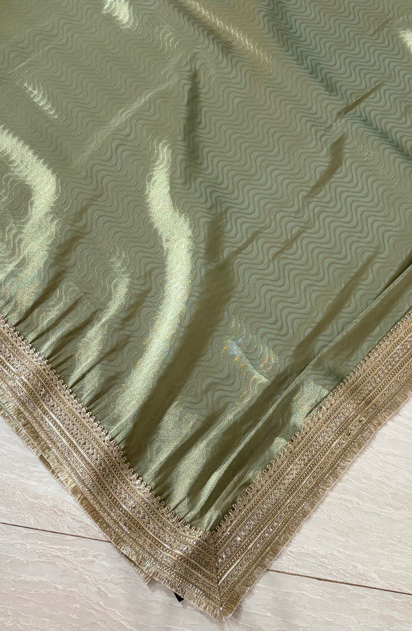 The Sage Luminary: Metallic Sage Green Silk Tissue Saree with Silver Lace Border