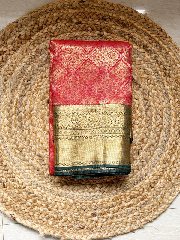 The Kalyani Mayura: Coral Peach & Bottle Green Kanchipuram Silk Saree