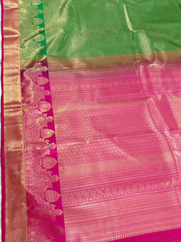 The Devika Mayura: Parrot Green & Rani Pink Kanchipuram Silk Saree