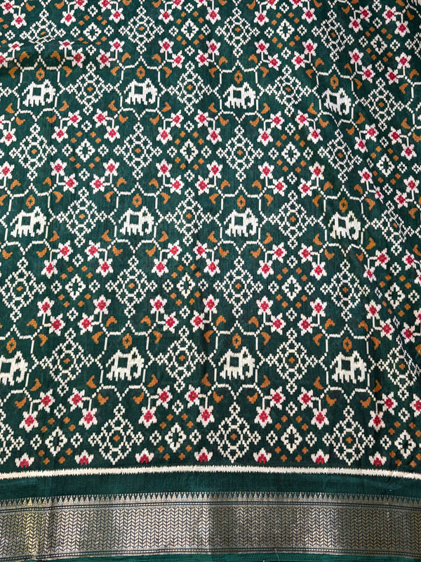 The Meenakshi Riva: Forest Green Patola Printed Saree
