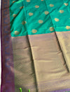 The Monsoon Glow: Mint Emerald Satin Silk Saree with Magenta Contrast & Tree-of-Life Buttis