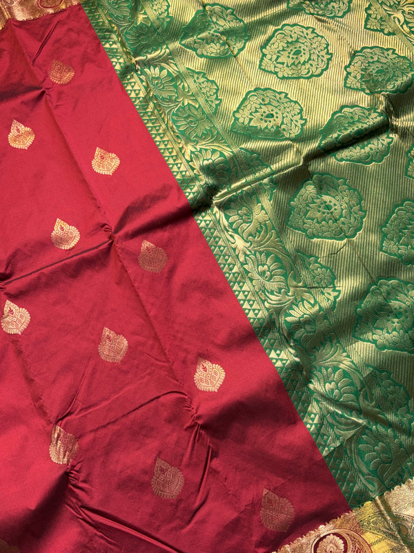 The Crimson Vasundhara: Deep Maroon & Emerald Green Heritage Woven Saree