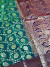 The Royal Medallion: Sea Green Silk Saree with Purple Borders