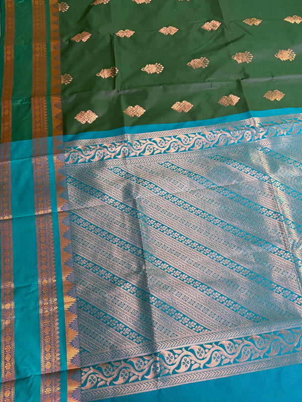 The Emerald Court: Forest Green Silk Saree with Turquoise Contrast Pallu