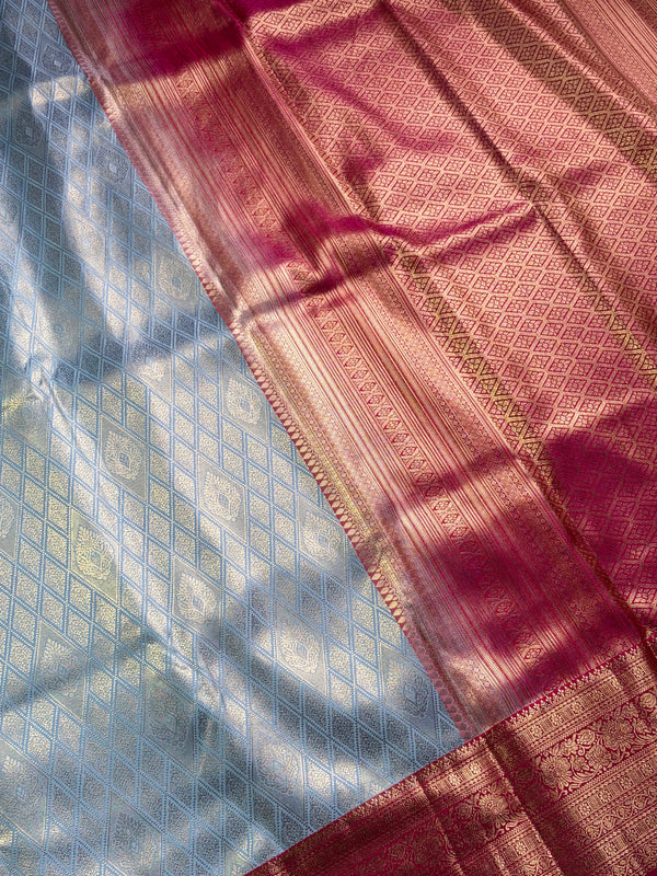 The Silver Frost: Pastel Silver-Blue Kanchipuram Silk Saree with Vermilion Red Zari Border