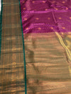 The Amethyst Temple: Deep Plum Kanchipuram Silk Saree with Emerald & Gold Border