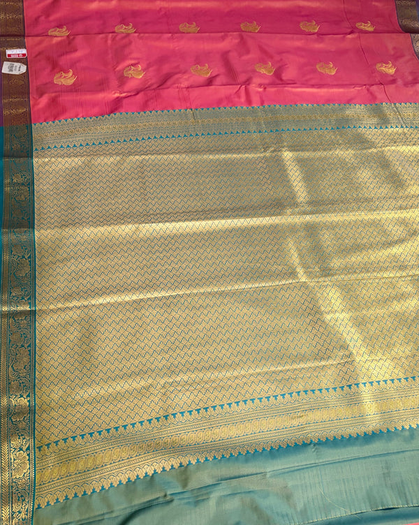 The Coral Mayil: Peach-Salmon Kanchipuram Silk Saree with Teal & Gold Zari Border