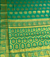 The Verdant Flow: Emerald Green Crepe Silk Saree with Gold Zari Buttas