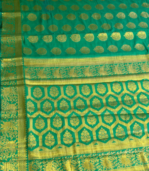 The Verdant Flow: Emerald Green Crepe Silk Saree with Gold Zari Buttas