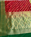 Red silk, green borders, and timeless vibes.