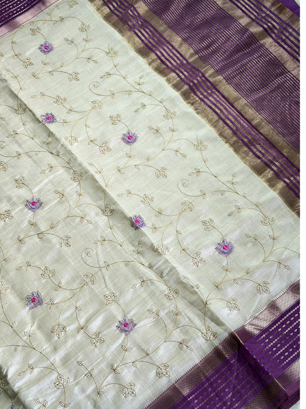 Elegant cream raw silk saree with a rich purple border for a regal touch. 🤍💜✨