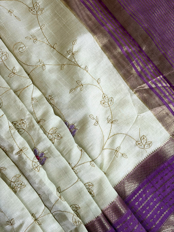 Elegant cream raw silk saree with a rich purple border for a regal touch. 🤍💜✨