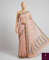 Soft pink linen saree with a charming floral border — light, fresh, and elegant