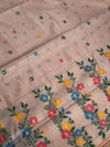 Soft pink linen saree with a charming floral border — light, fresh, and elegant