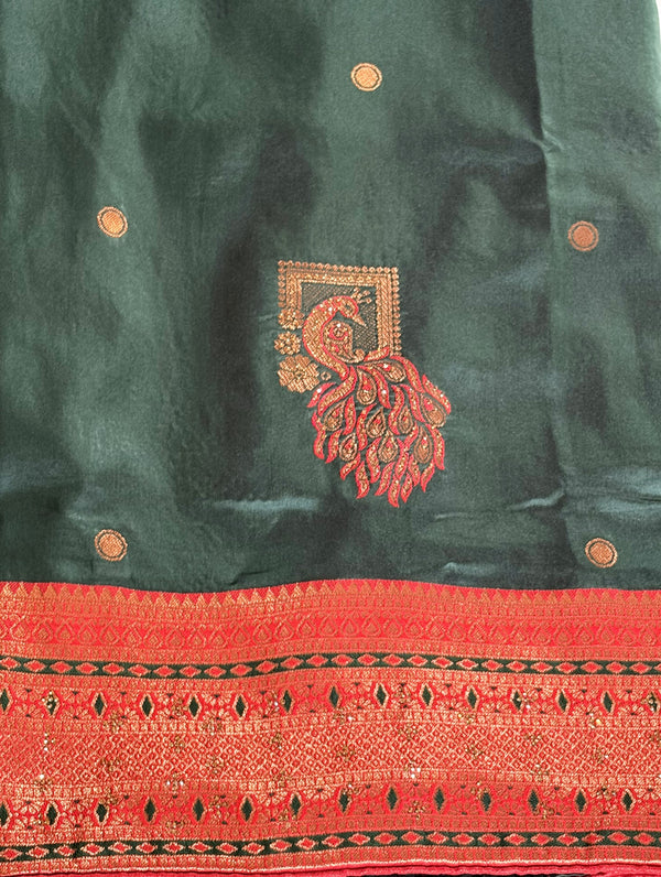 Elegant green saree with a rich red border and delicate diamond work — a perfect blend of tradition and sparkle.