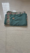 The Tanvi Riva: Peacock Teal Floral Embroidered Georgette Saree