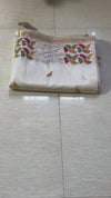 The Ivory Aranya: Ivory Tussar Cotton Silk Saree With Multi-Color Tribal Embroidery